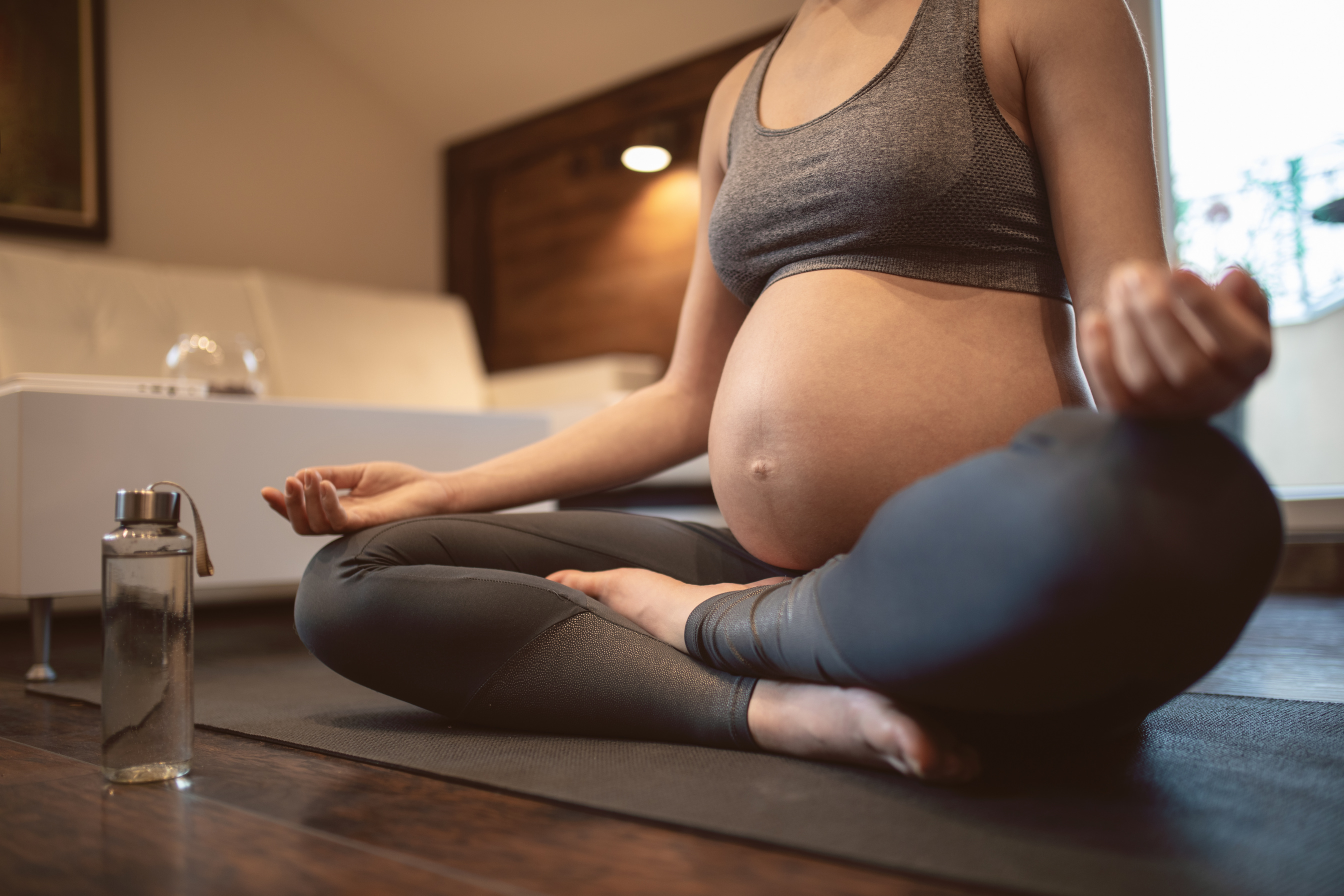 Pregnant Woman Doing Prenatal Yoga at Home